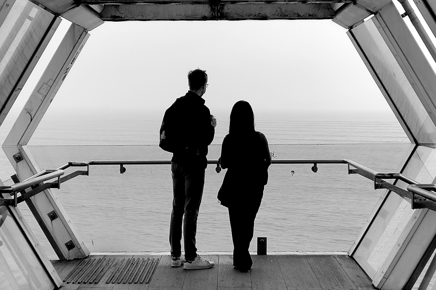 A couple standing on a viewing platform in Blackrock train station
